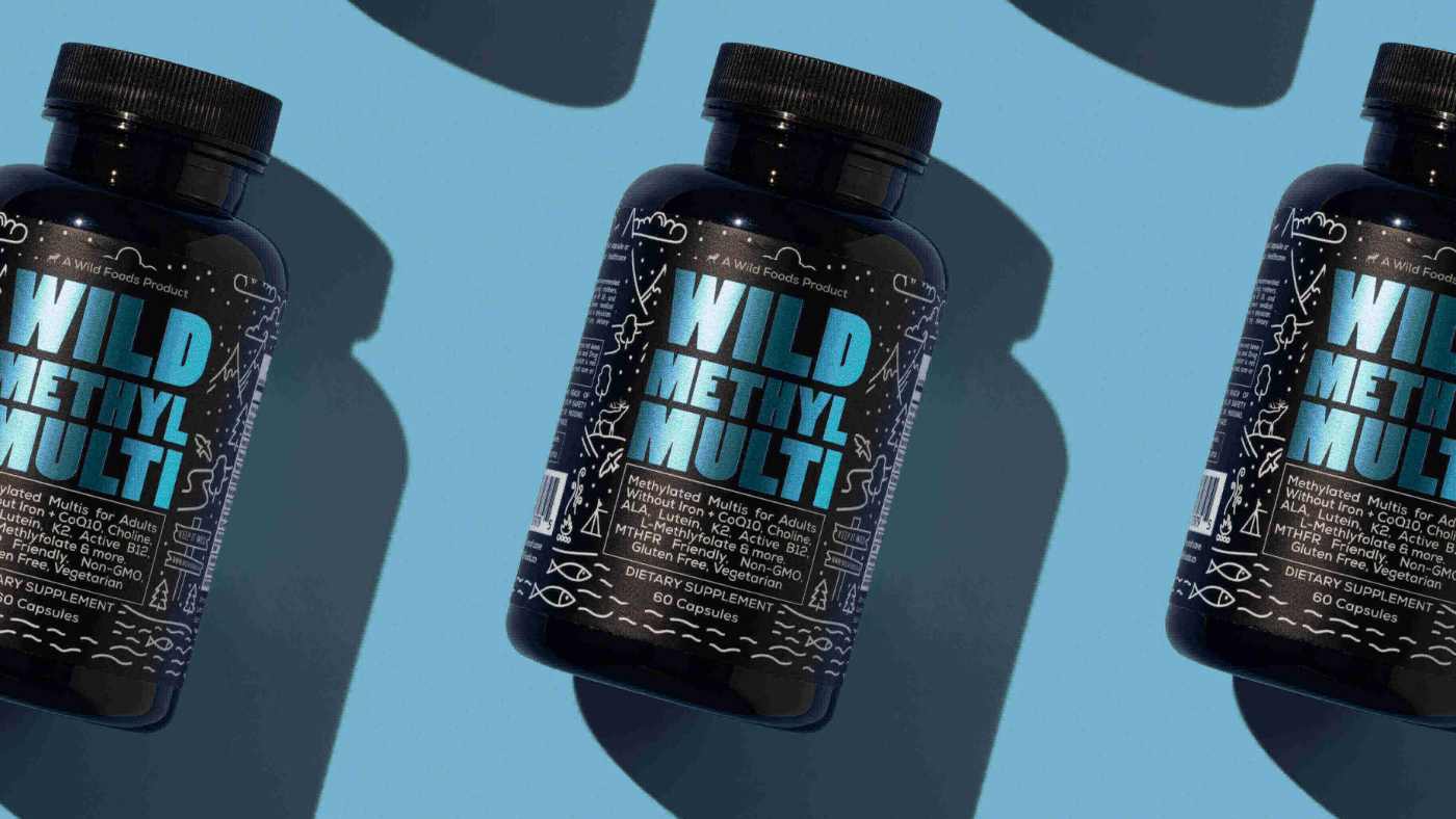 Three bottles of 'Wild Methyl Multi' supplements on a blue background.