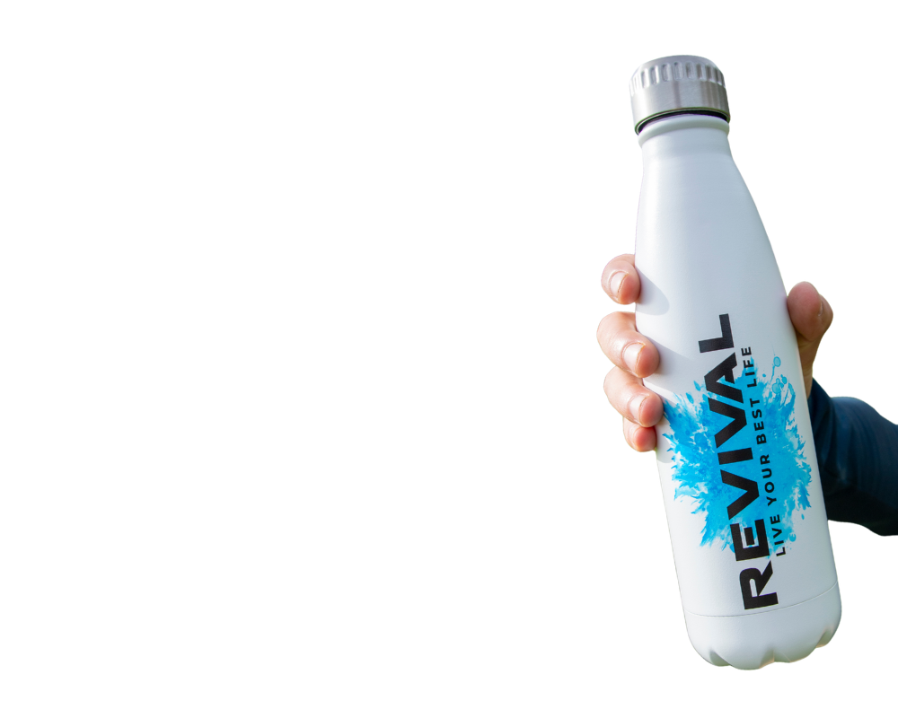 A hand holds a white reusable water bottle with a blue and black 'REVIVAL' logo.