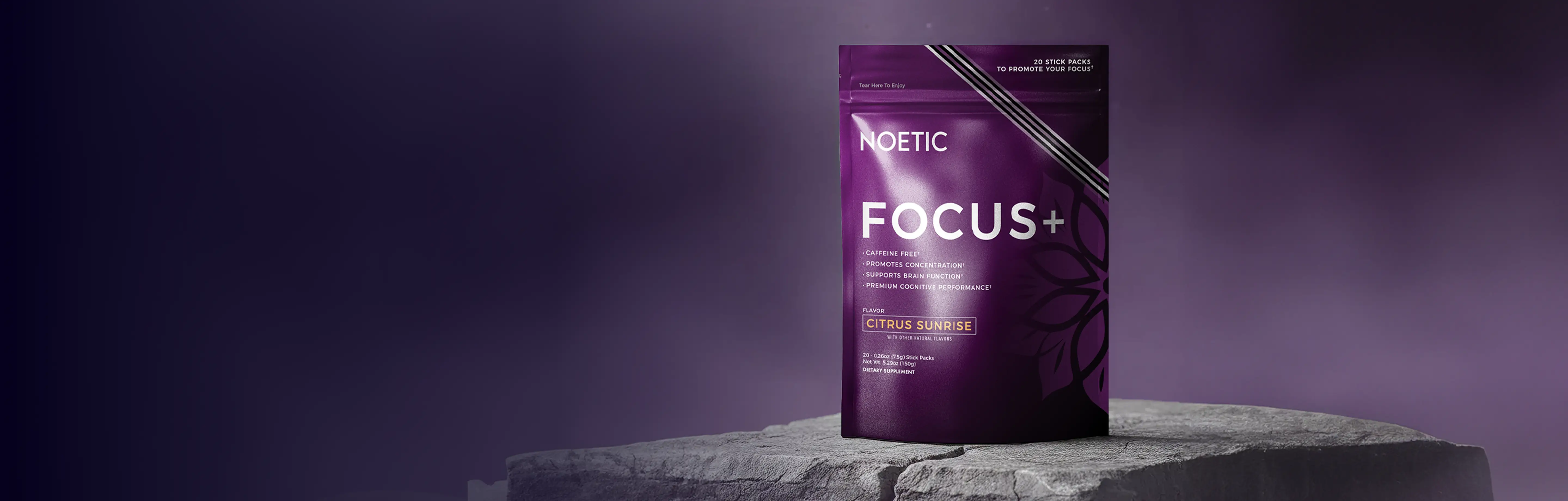 Purple NOETIC Focus+ package on a stone surface.