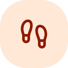 A circular icon with two brown footprints.