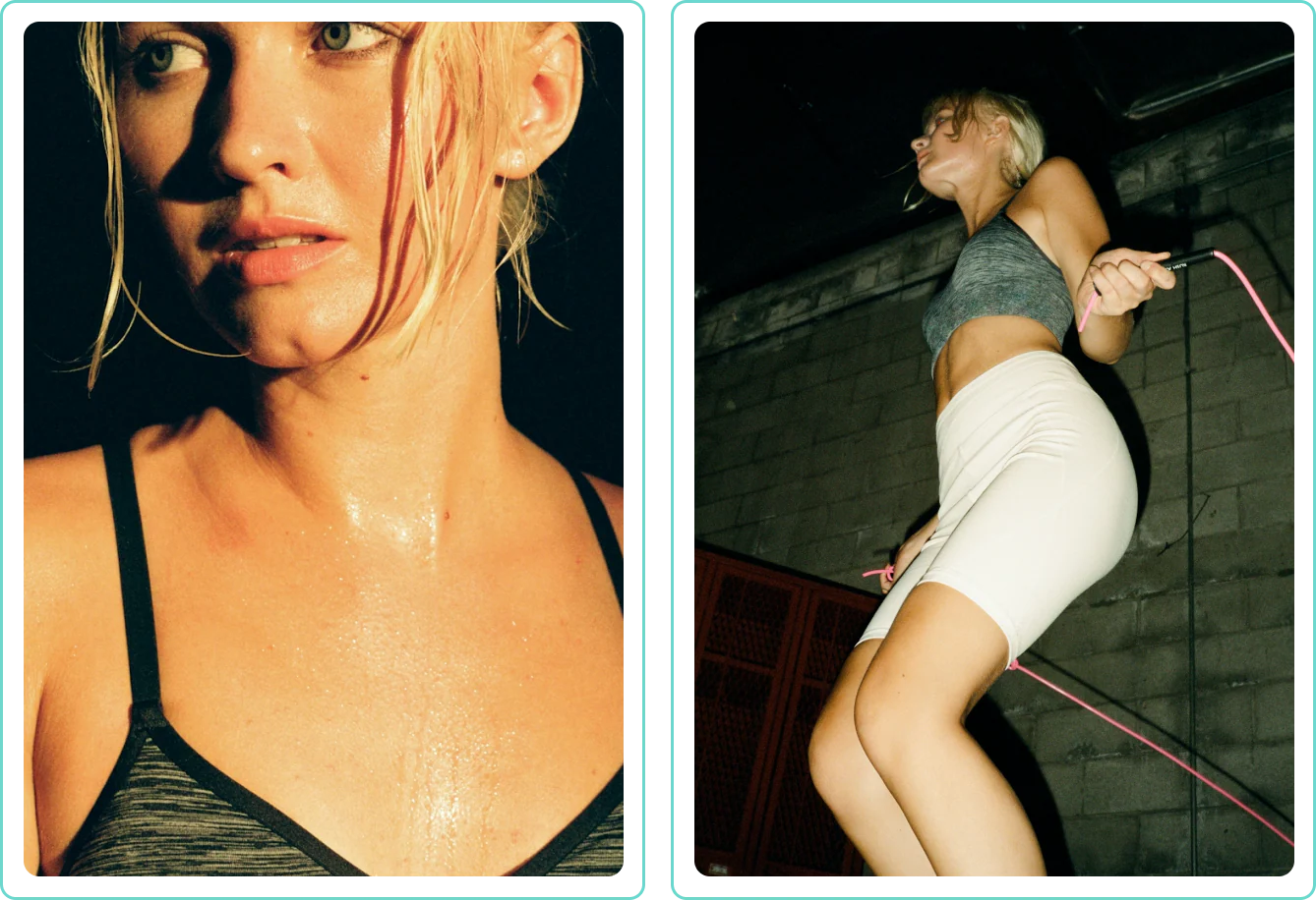Woman sweating in workout clothes, jump roping in a gym.