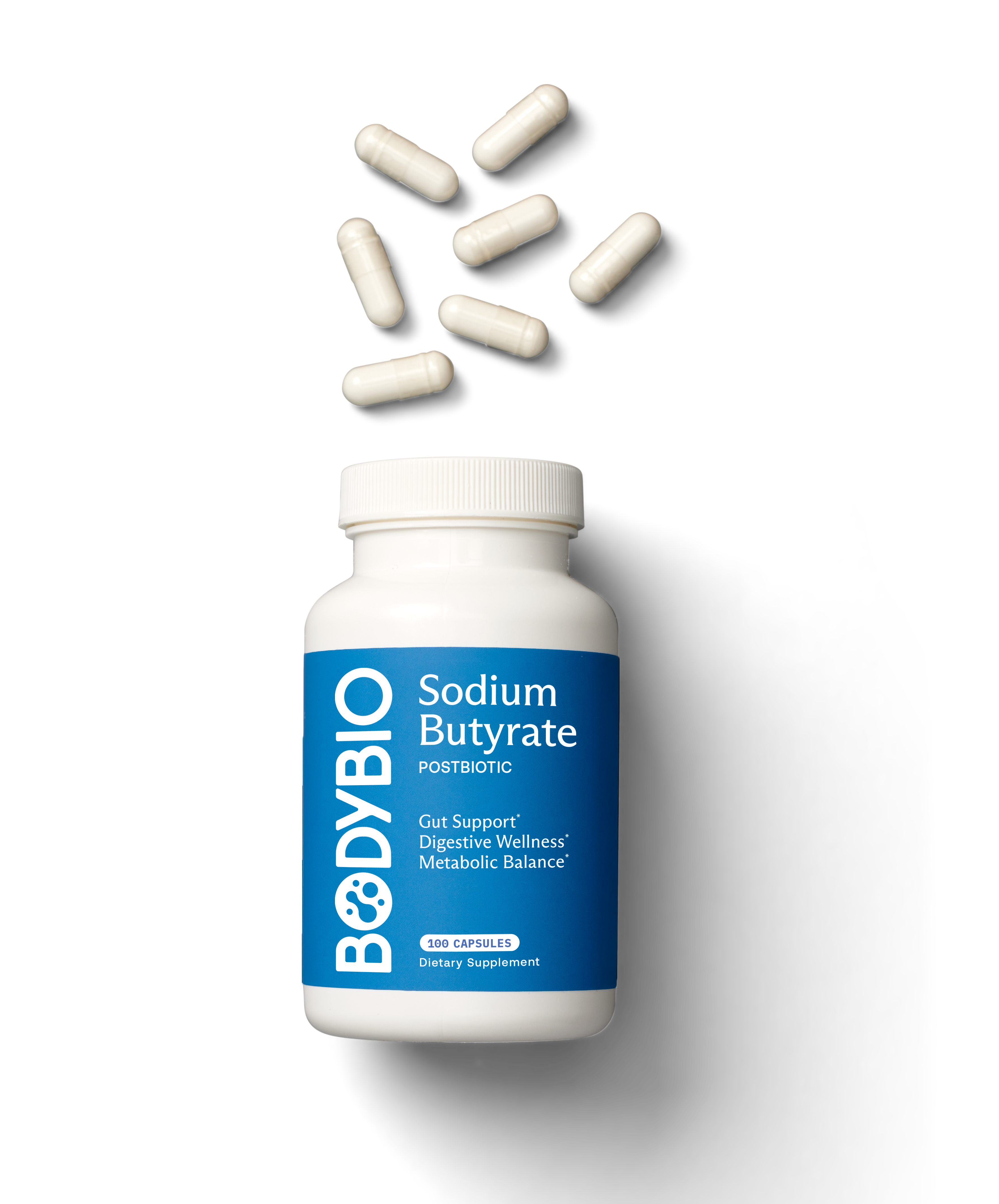 Bottle of sodium butyrate capsules with several capsules floating above.