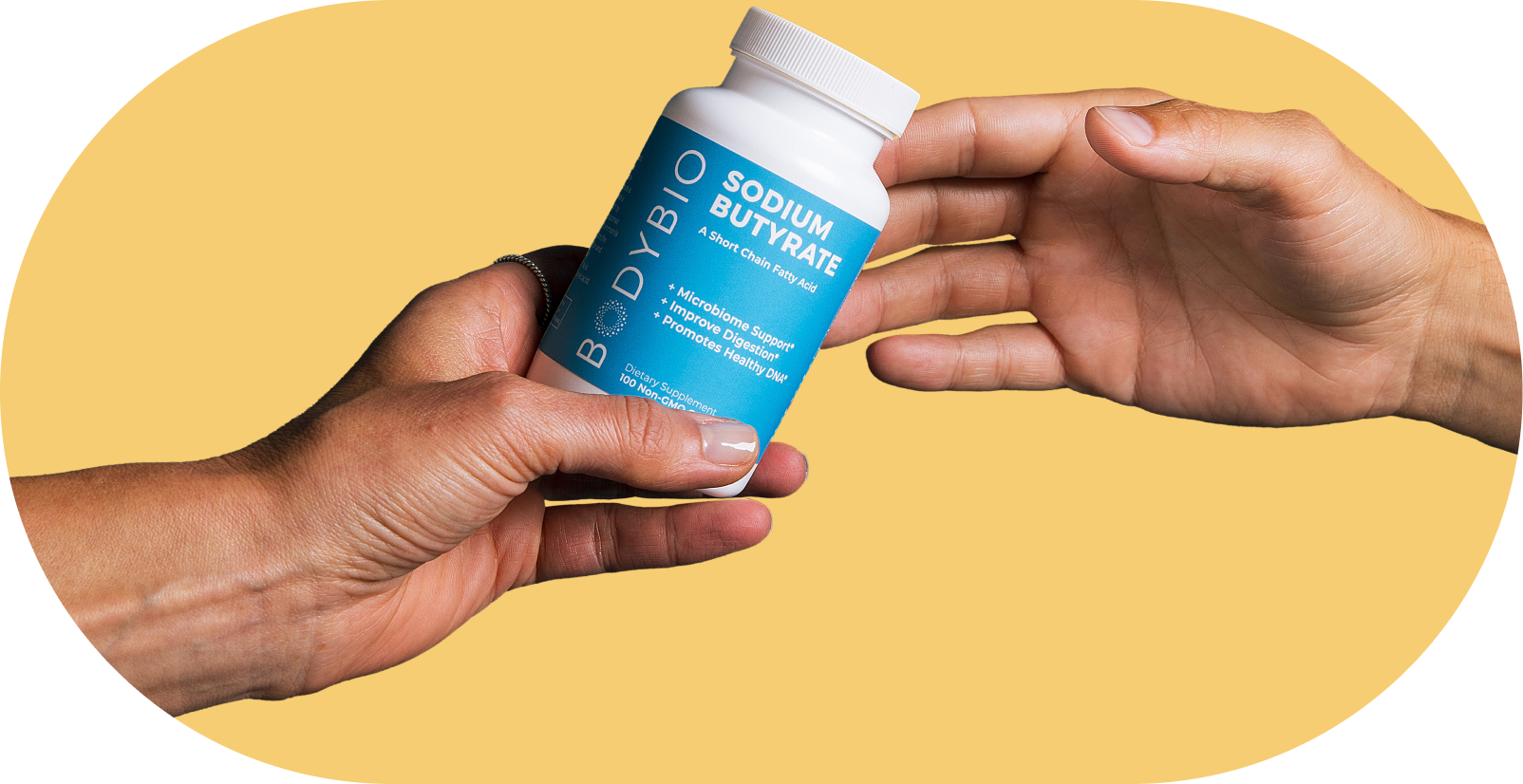 Two hands exchanging a bottle labeled 'Sodium Butyrate' against a yellow background.