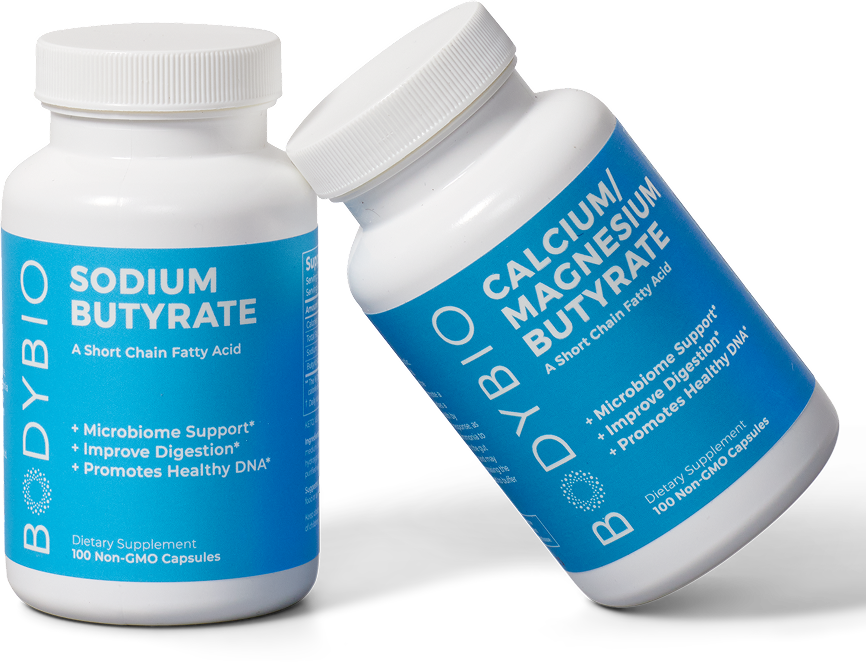 Bottle of sodium butyrate capsules with some capsules floating above.