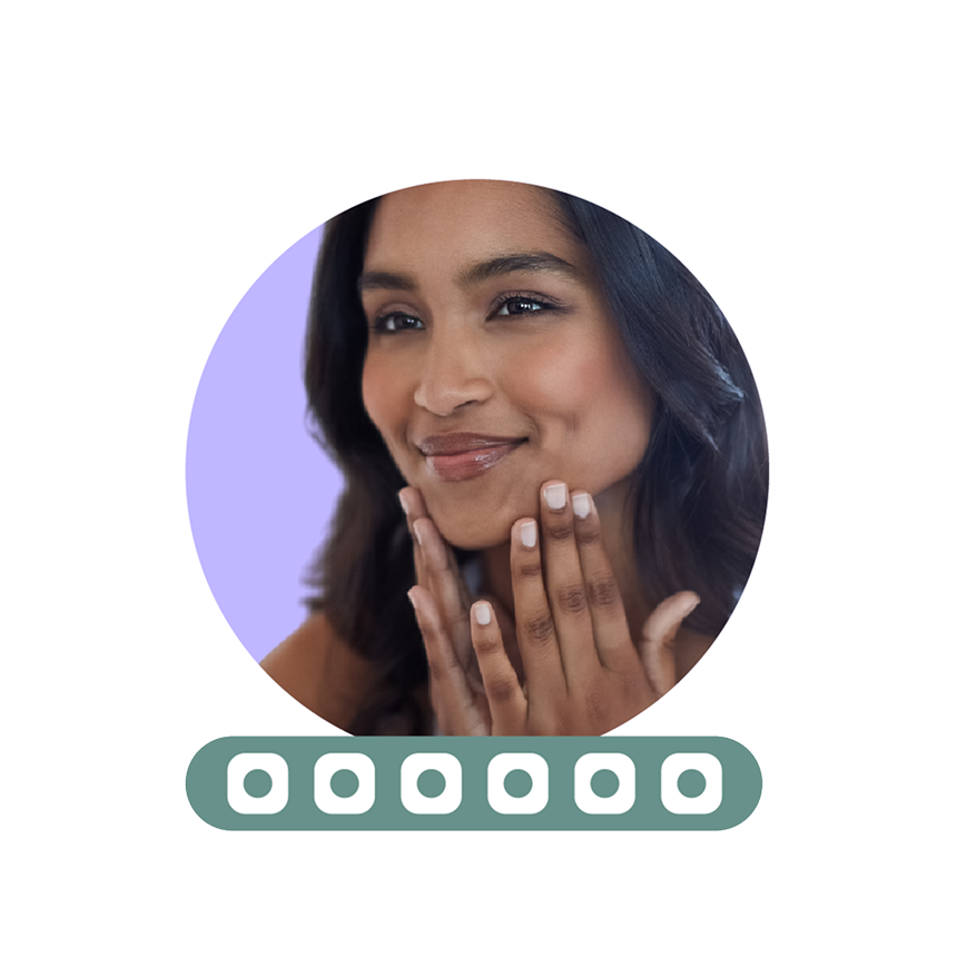 Smiling person touching their face with hands, framed in a circular border.