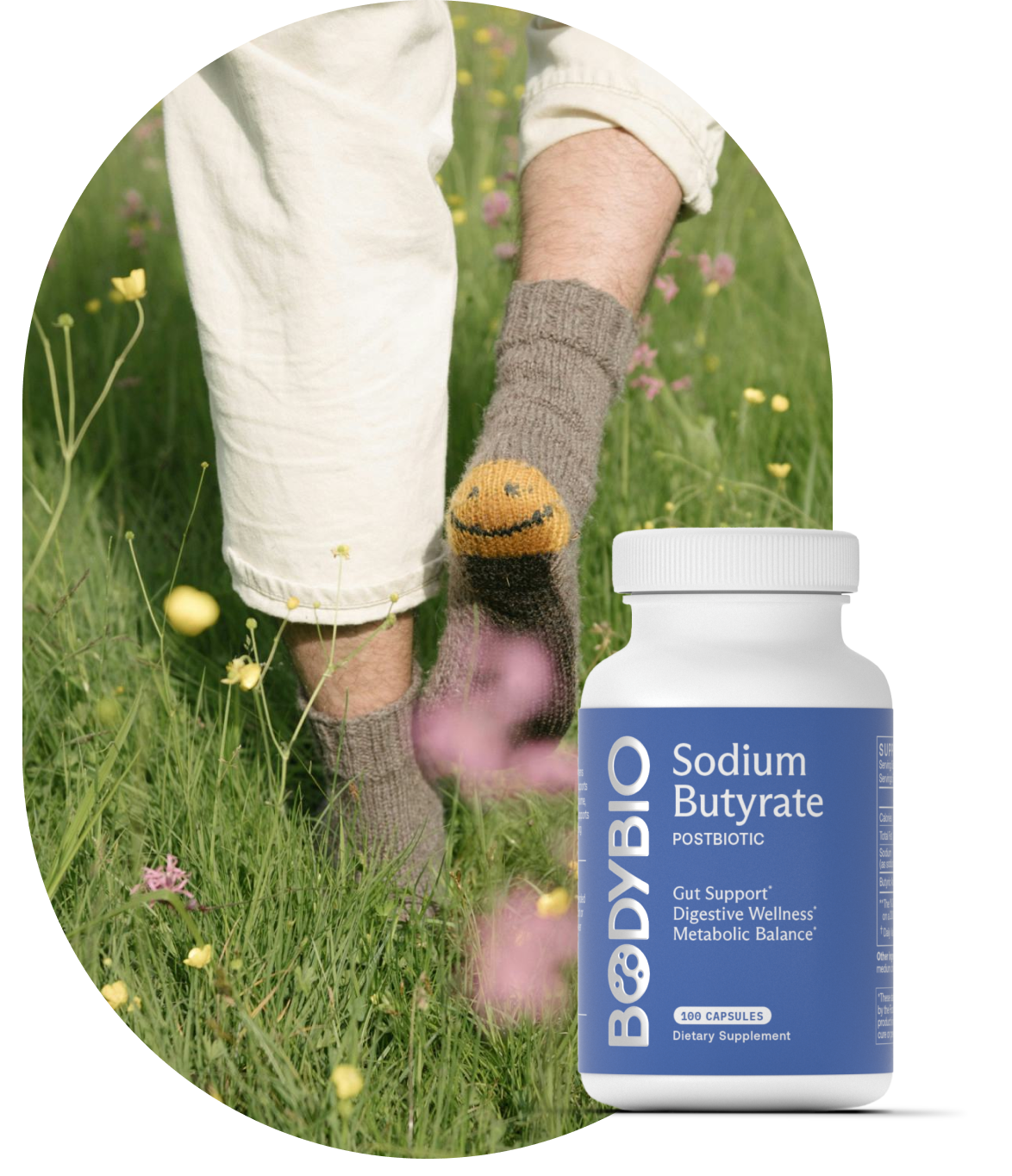 Person in socks walking in grass, with a bottle of Sodium Butyrate supplement.