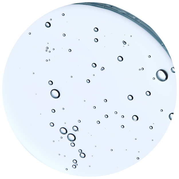 Clear circular surface with scattered bubbles.