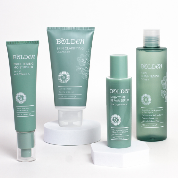 Four Bolden skincare products in green packaging arranged on a white background.