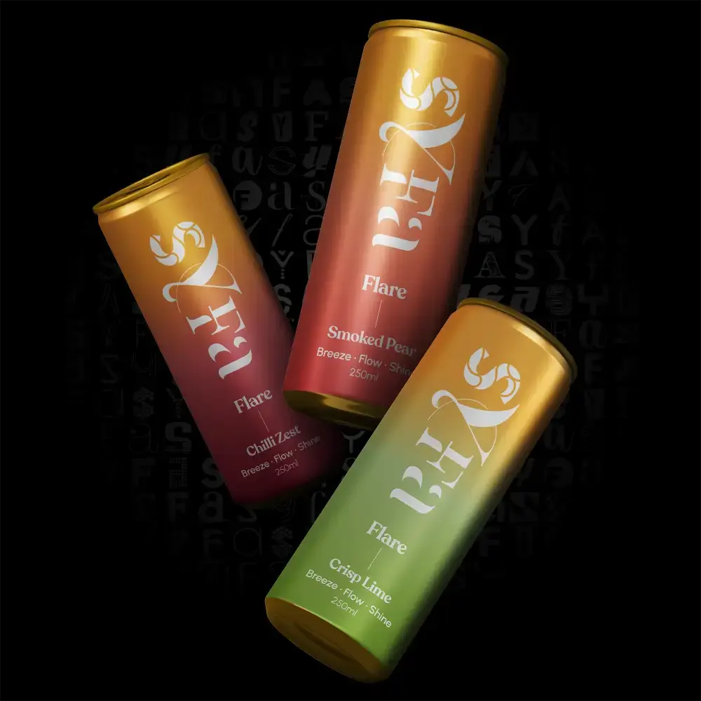 Three colorful beverage cans with different flavors on a black background.