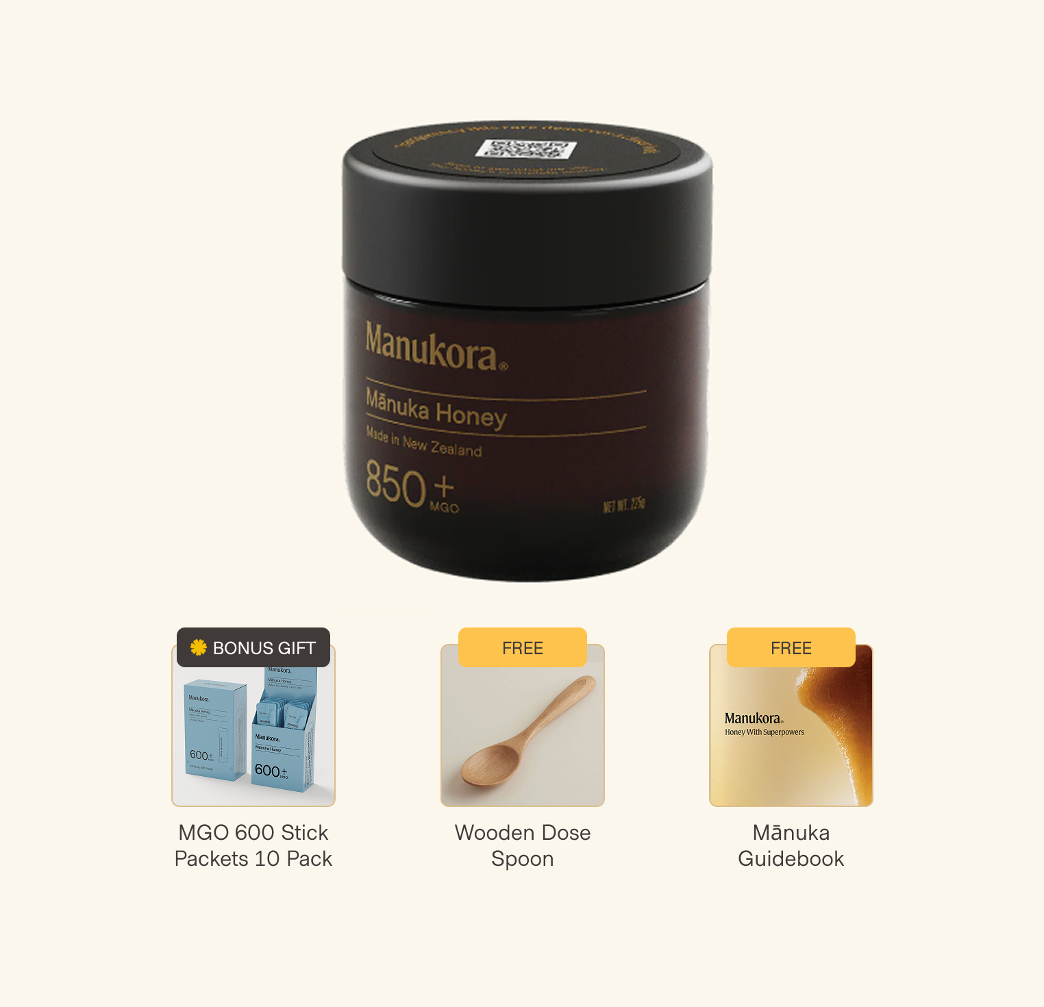 Manuka honey jar with bonus gifts: packets, wooden spoon, and guidebook.