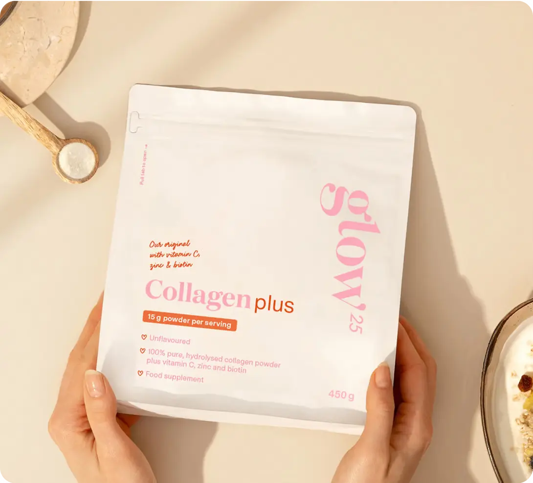 Hands holding a collagen supplement package on a beige background.
