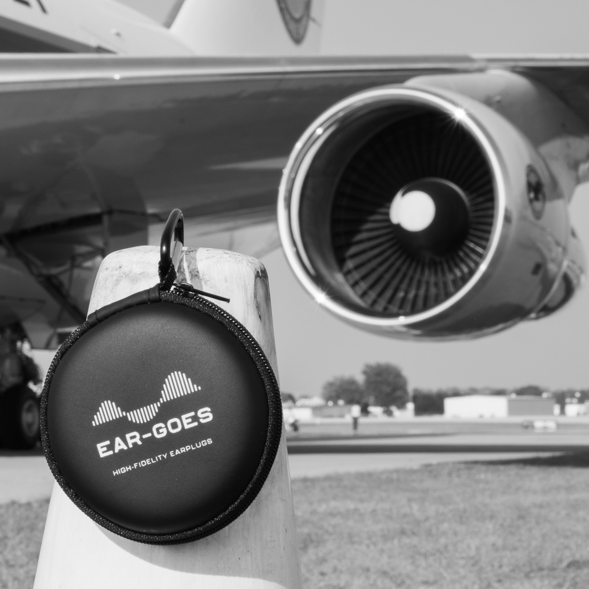 Ear-Goes X27 high fidelity earplugs for aviation near a jet engine on the runway