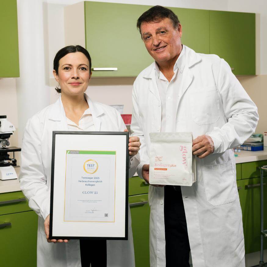 Two people in lab coats, one holding a certificate, the other a product package in a laboratory.