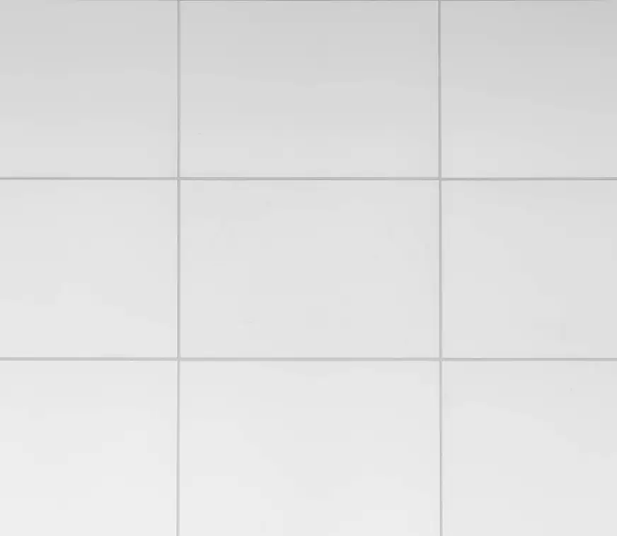 White square tiles arranged in a grid pattern.