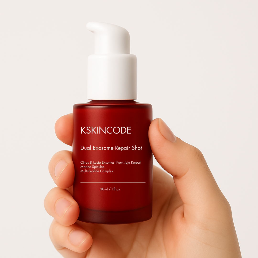 Hand holding a red bottle labeled 'KSKINCODE Dual Exosome Repair Shot.'