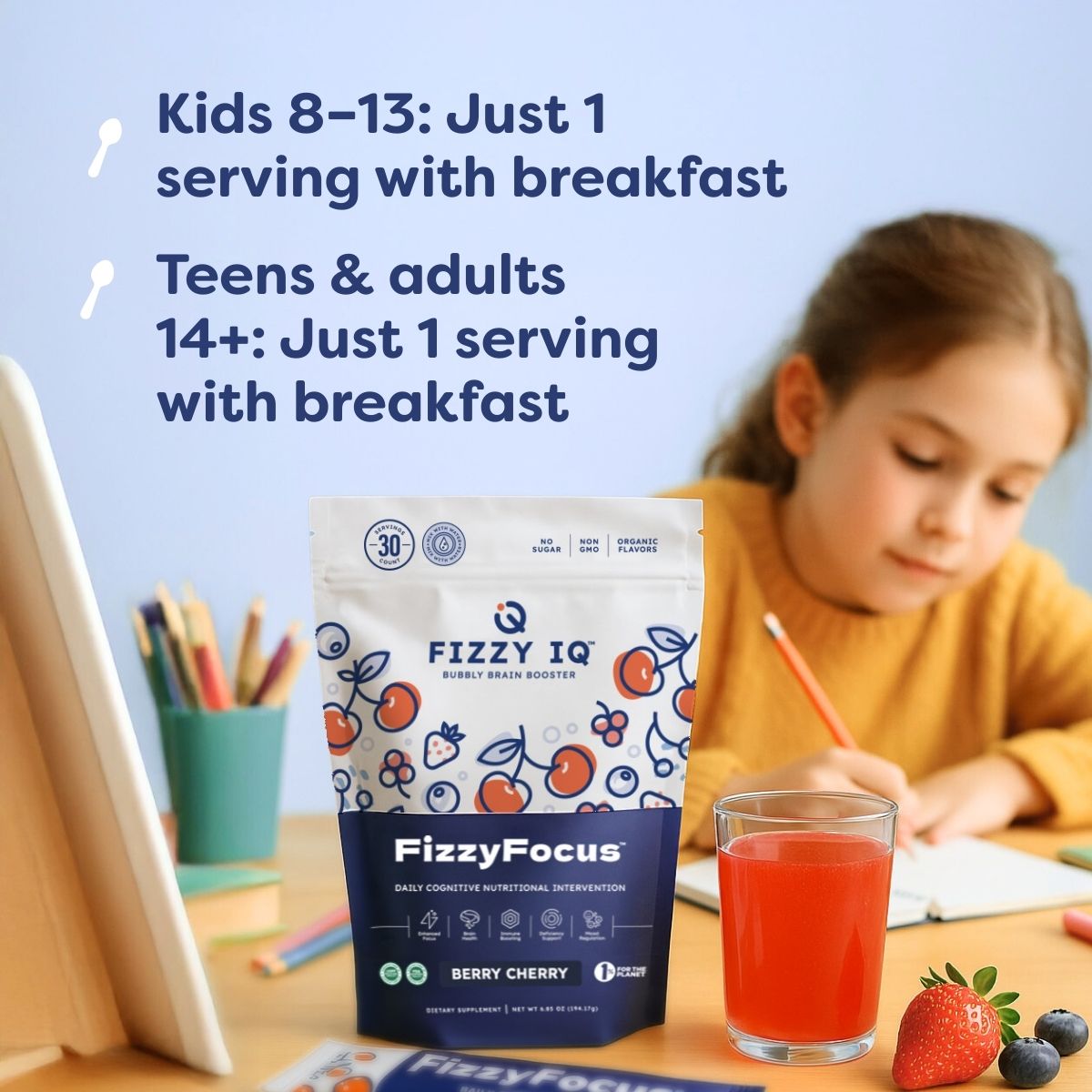 Child writing at desk with Fizzy IQ product and glass of red drink.