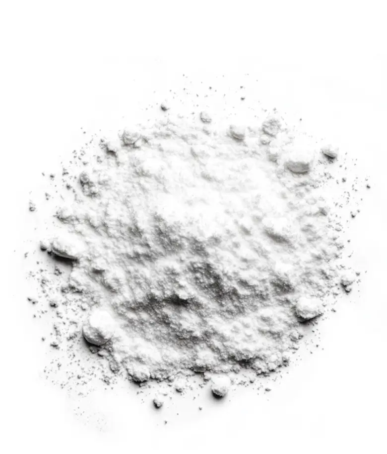 An overhead close-up shot of a small pile of fine white powder on a white background.