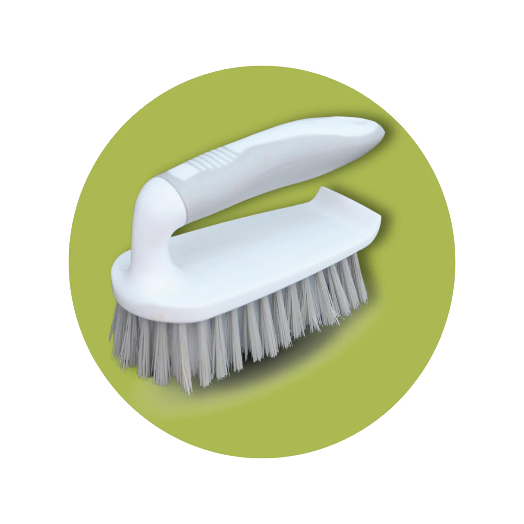 A white-handled scrub brush with grey bristles sits inside a green circle.