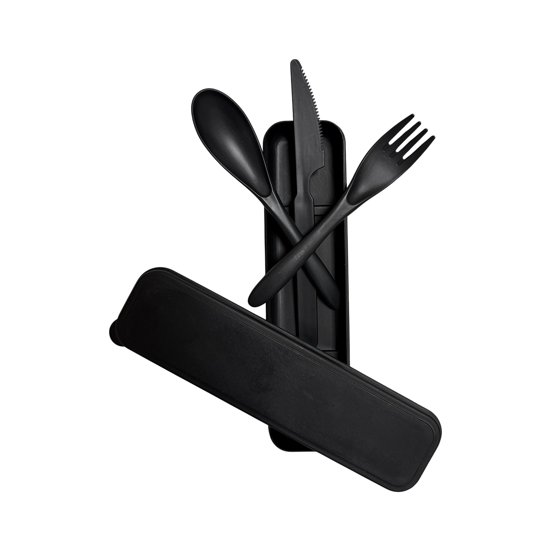 Black cutlery set with spoon, fork, and knife on a black background.