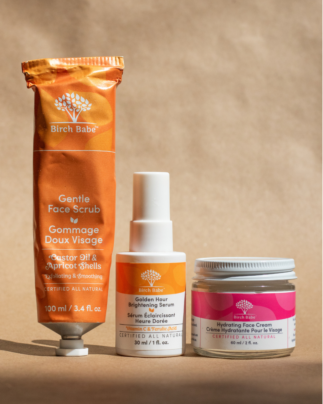Three skincare products against a neutral background.