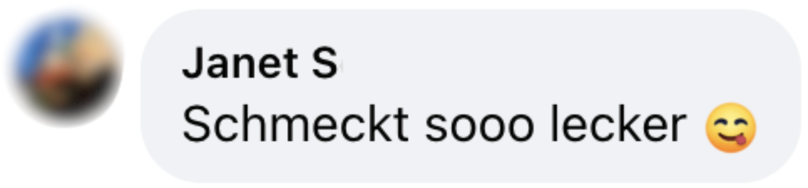 German text saying something is delicious, with smiley emoji with tongue out.