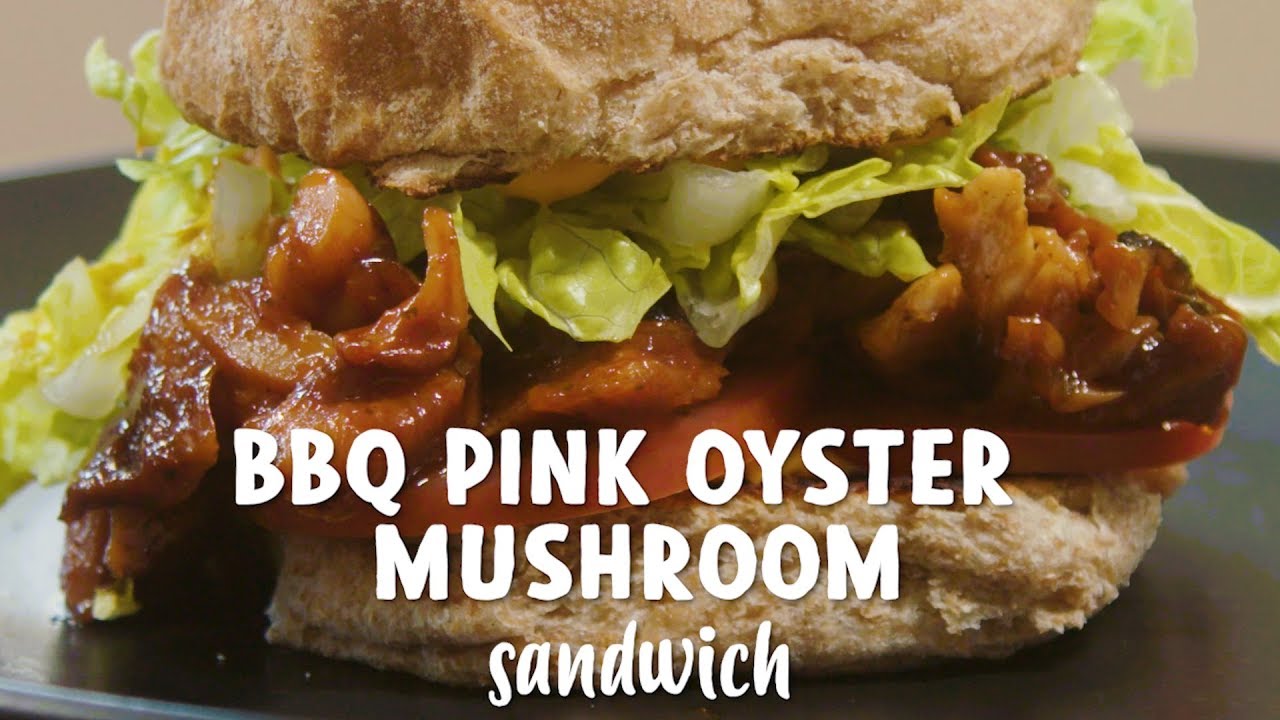 Close-up of a BBQ pink oyster mushroom sandwich with lettuce.
