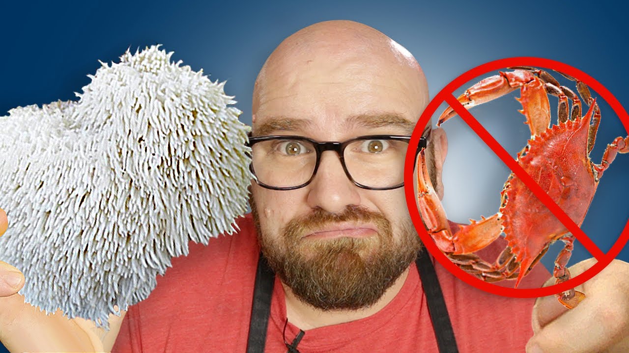 Person holding a white fuzzy object, red crab with a prohibition sign.