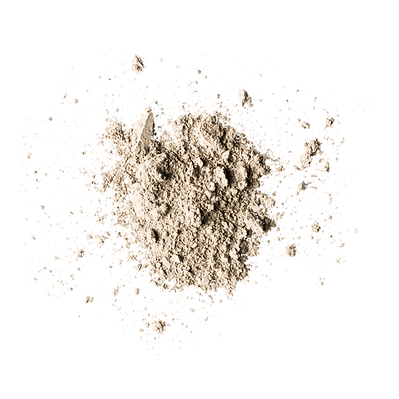 A pile of light brown powder scattered on a white background.