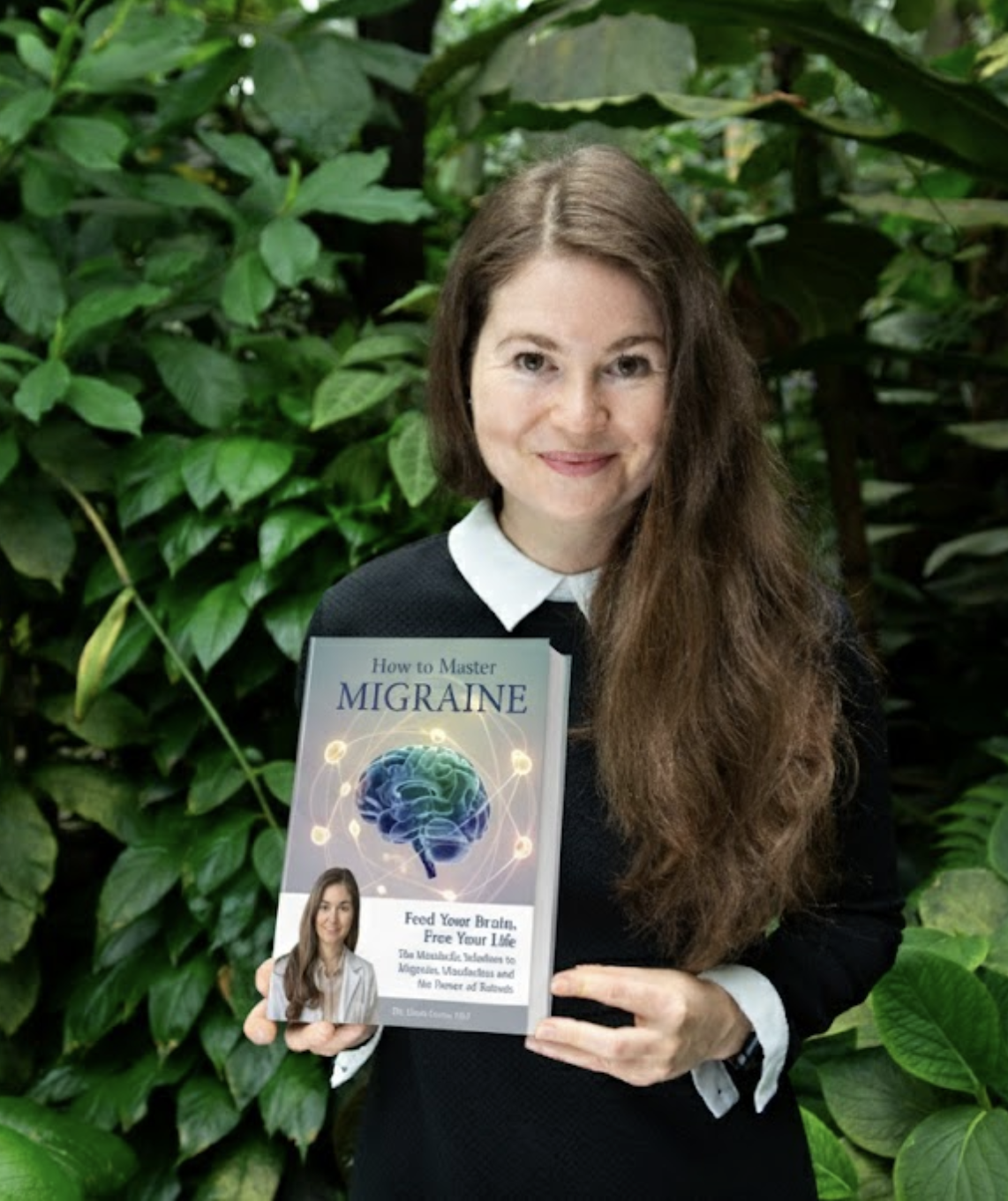 Woman holding a book titled 'How to Master Migraine' in a leafy setting.