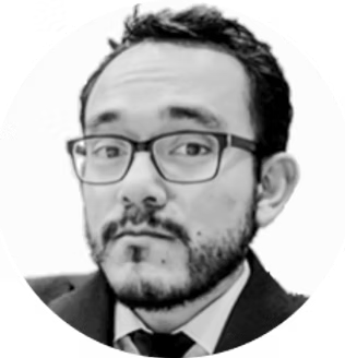 Black and white portrait of a man with glasses and a beard.