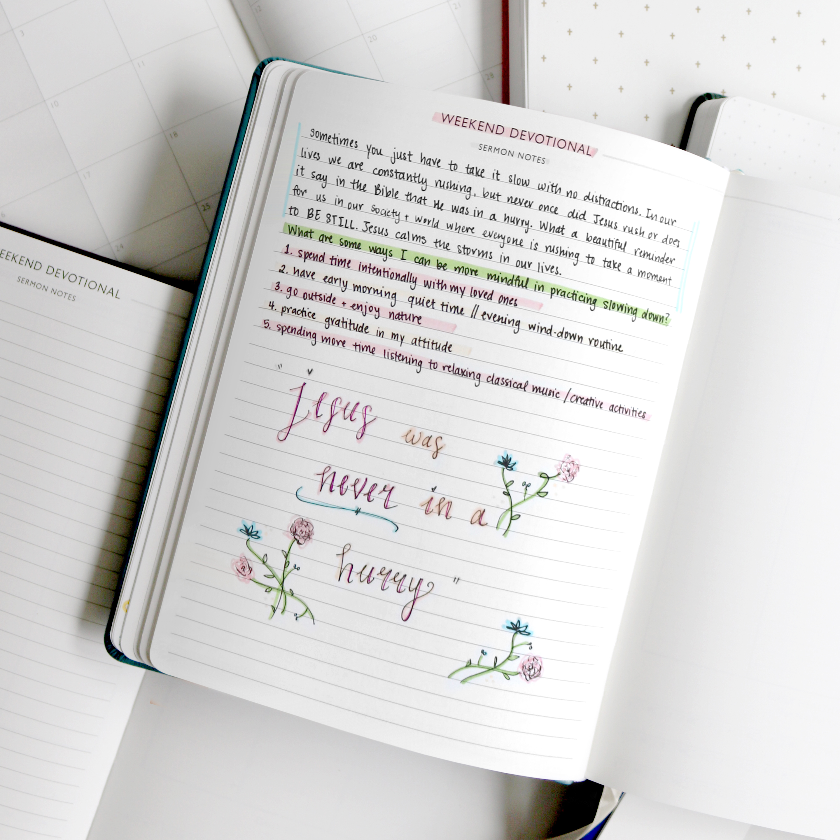 A close-up of a journal with handwritten devotional notes, highlighted text, and a calligraphed quote with flower doodles.