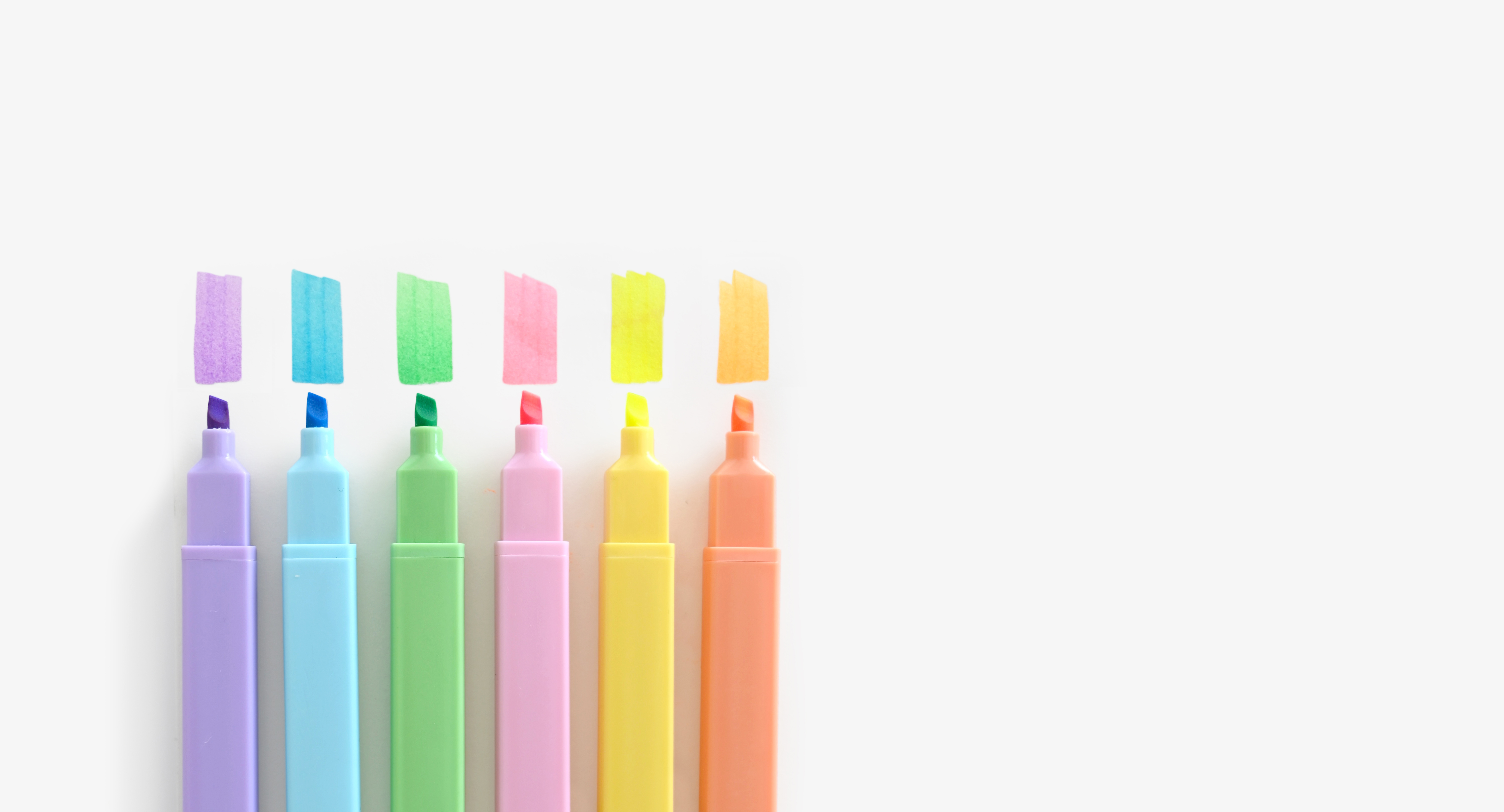 Japanese snack box with tea, snacks, and utensils against a red background.