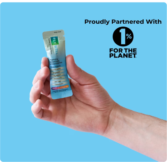 Hand holding a packet with '1% for the Planet' logo on blue background.