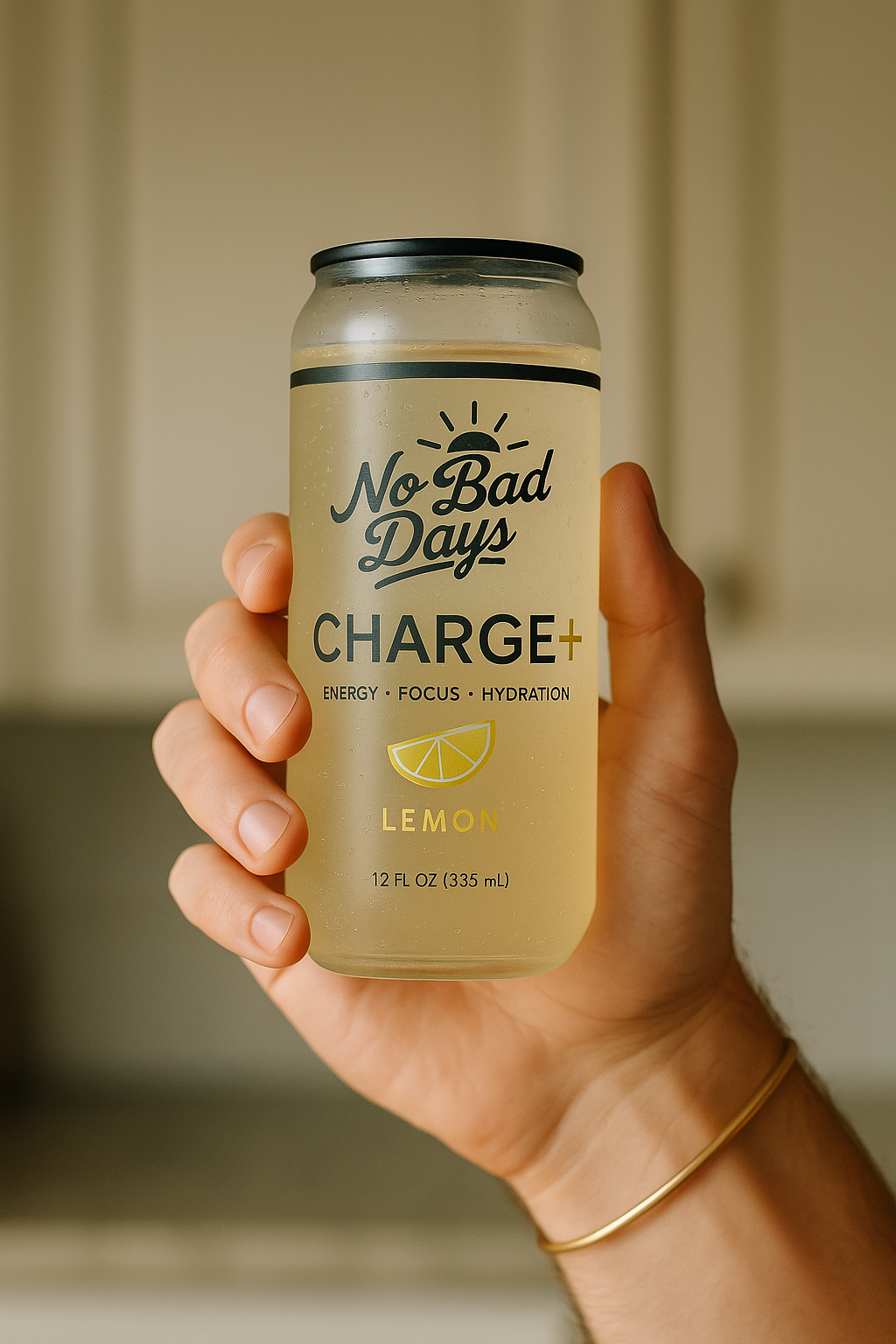 Hand holding a can labeled 'No Bad Days Charge+ Lemon'.