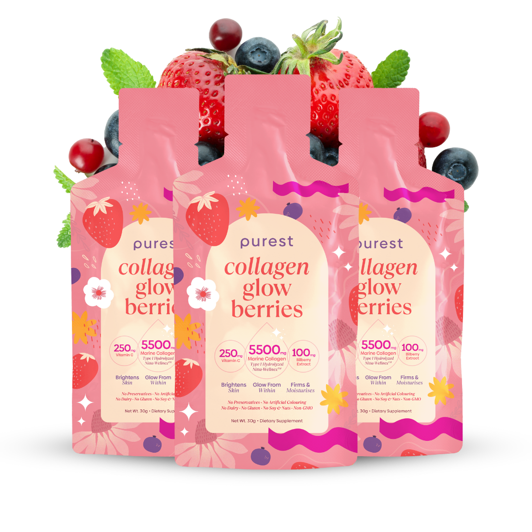 Three pink collagen supplement pouches with berries and leaves in the background.