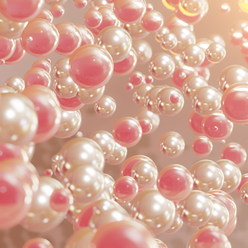 Abstract image of pink and white glossy spheres floating in a soft light.