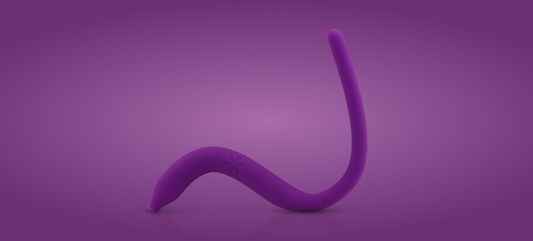 A purple, curved Intimate Rose pelvic wand on a matching purple background.