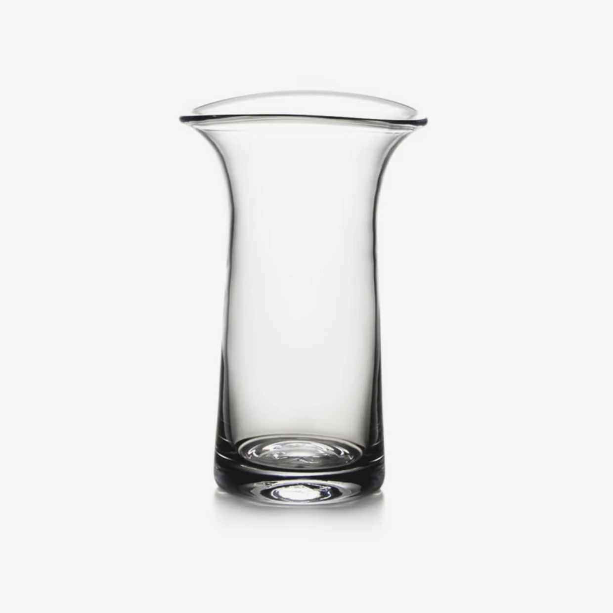 A tall, clear glass vase with a flared rim, shot against a white background.