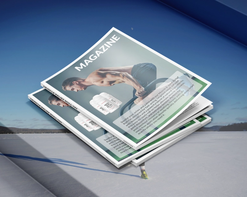 Stack of fitness magazines on a snowy surface.