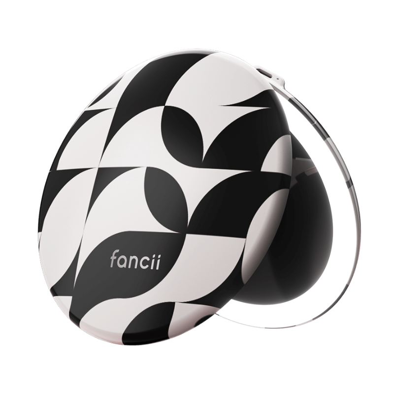 Compact mirror with black and white geometric pattern and a lighted edge.