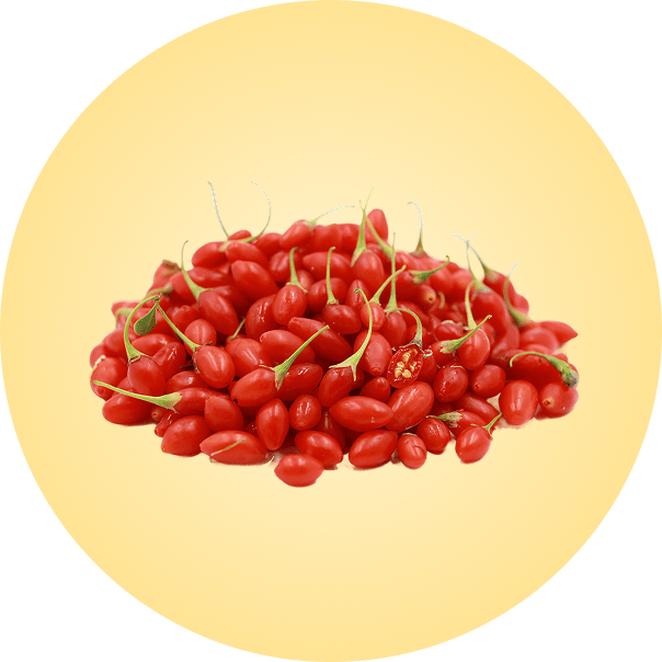 A pile of red berries with green stems on a yellow background.
