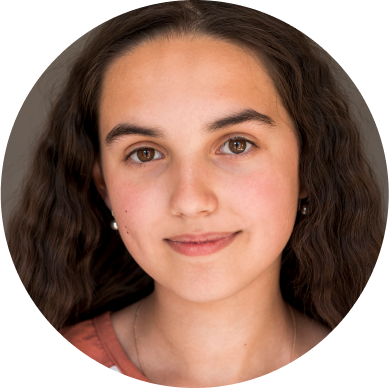 Portrait of a person with long brown hair and a neutral expression.