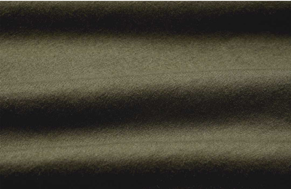 Close-up of olive green fabric with visible texture.