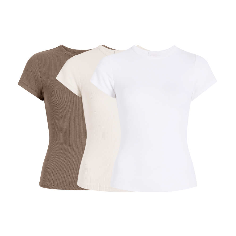 Three plain t-shirts in brown, beige, and white colors.