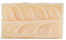 A beige bar of soap with a carved leaf pattern.