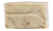 A bar of handmade soap with a textured surface.