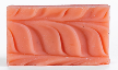 Rectangular pink soap with a wavy pattern.