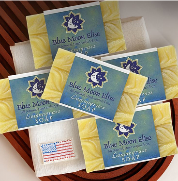 Five bars of Blue Moon Elise lemongrass soap on a wooden surface.