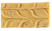 A textured yellow soap bar with swirled patterns and small specks.