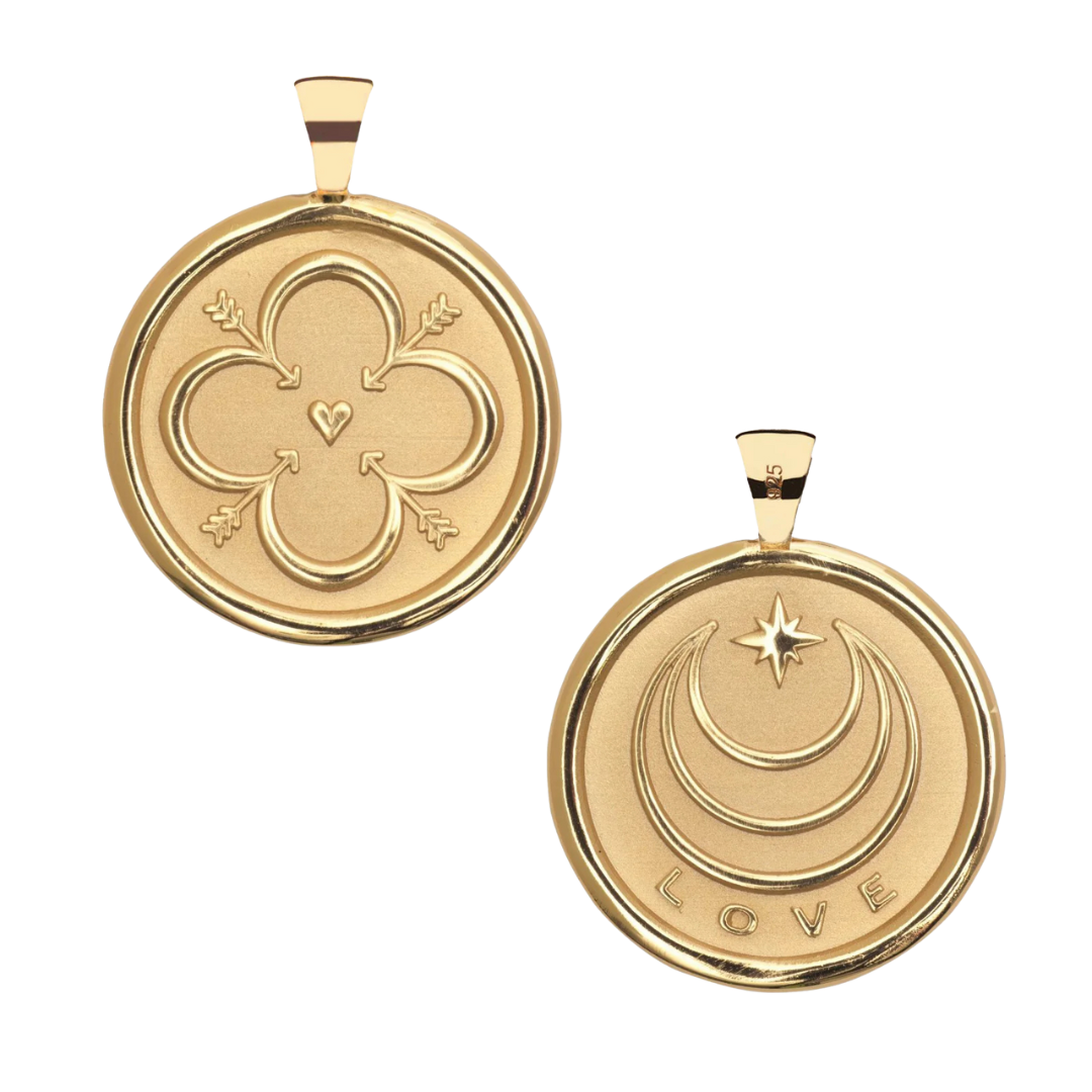 Two gold pendants with engraved designs and the word 'LOVE' on one.
